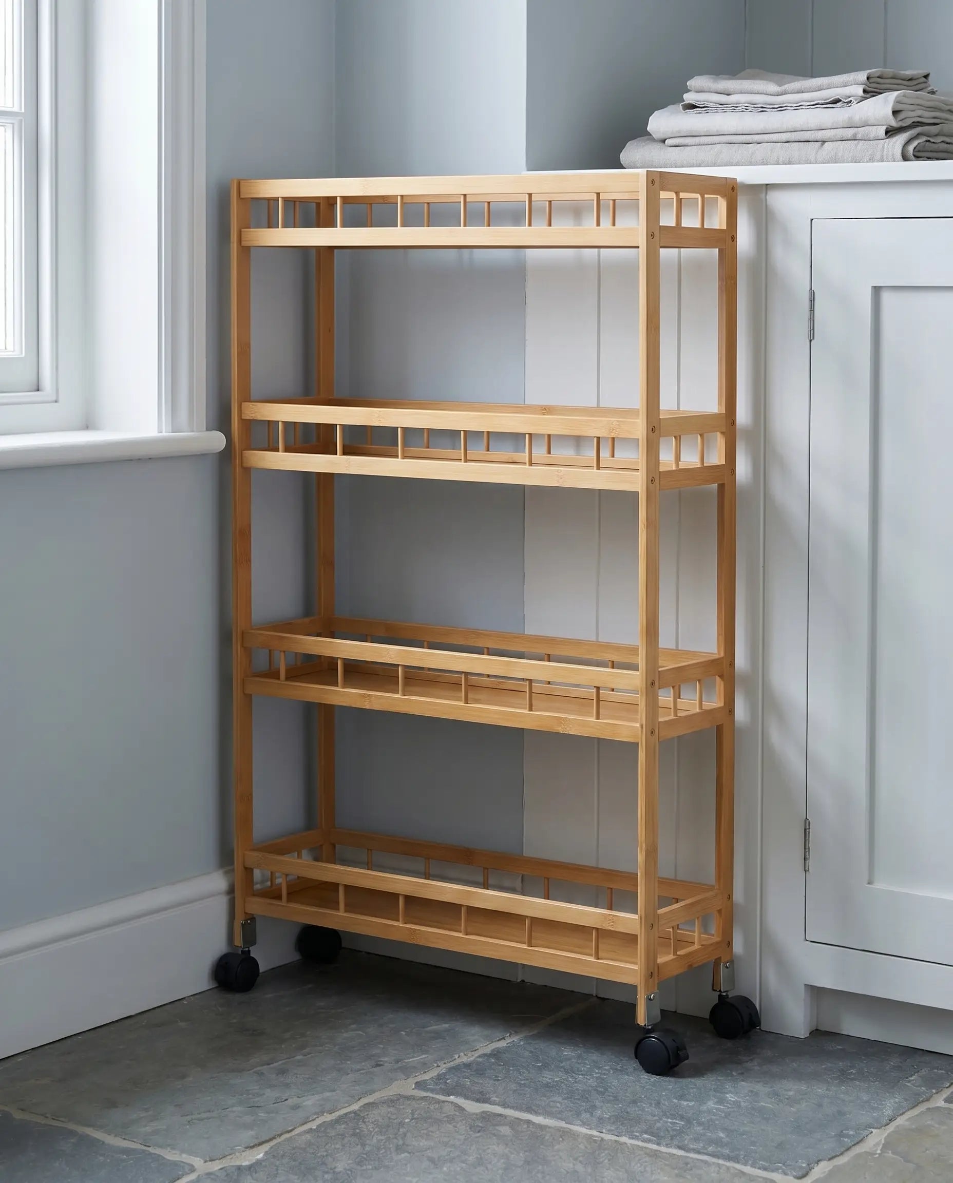 Slim bamboo trolley in a narrow kitchen gap